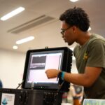 Chayse Jones points to a computer screen