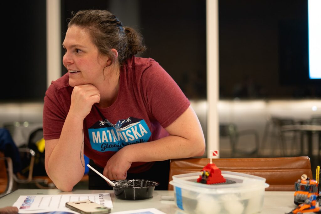 Carli Arendt talks to a visitor