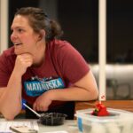 Carli Arendt listening to a visitor